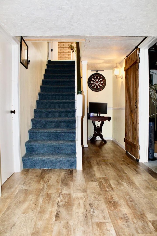 stairs with wood finished floors