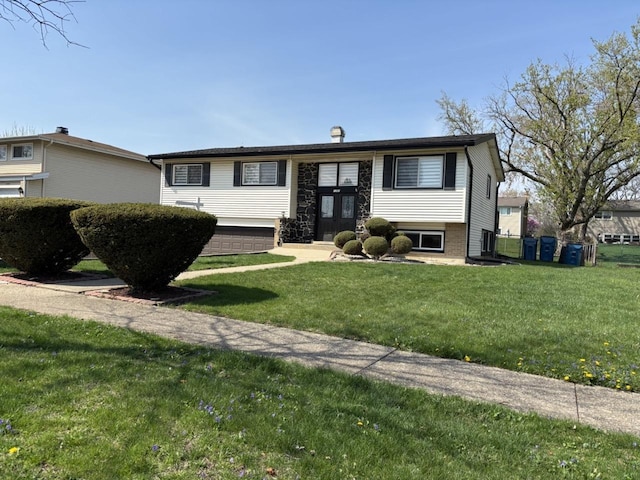 bi-level home with a front lawn