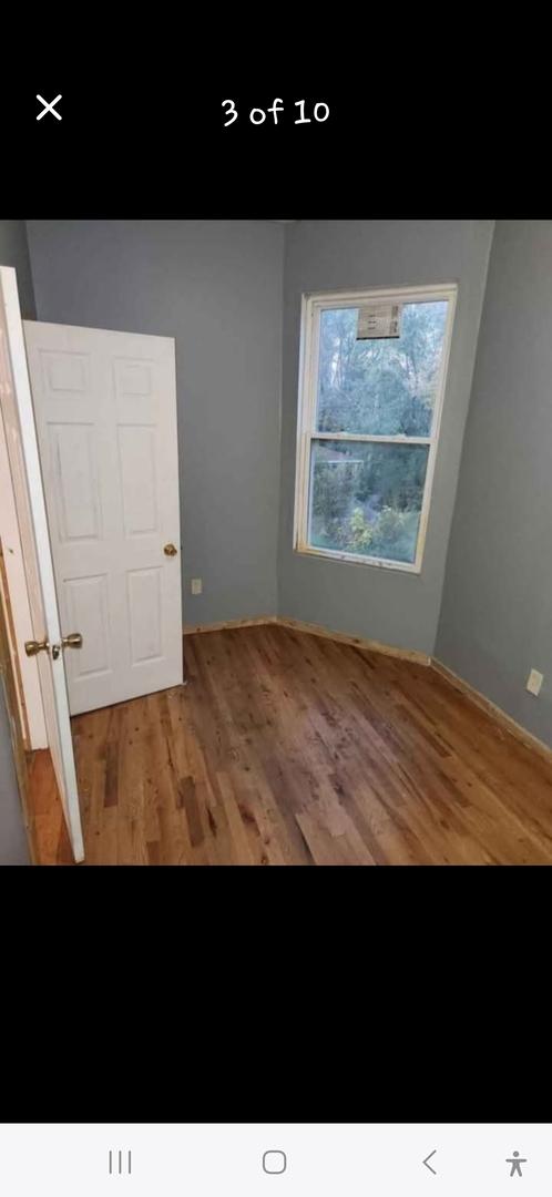 empty room featuring wood finished floors