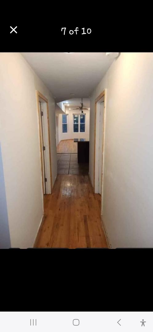 hall with light wood-style floors