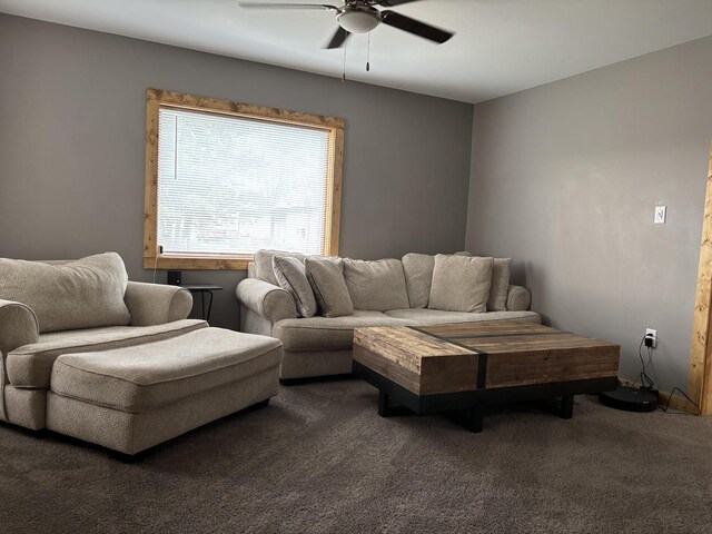 living area featuring carpet flooring and a ceiling fan