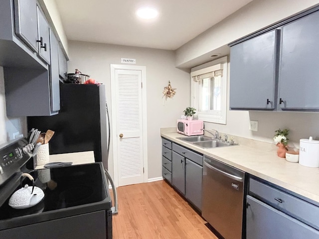 650 Cress Creek Ln, Crystal Lake, IL 60014 - kitchen with stainless steel dishwasher, electric stove, freestanding refrigerator, a sink, and white microwave