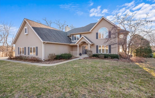 traditional home featuring a chimney, a front yard, and roof with shingles