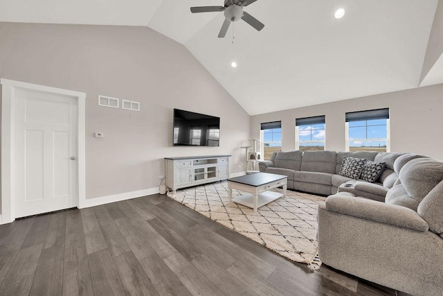 living area with visible vents, high vaulted ceiling, wood finished floors, and a ceiling fan