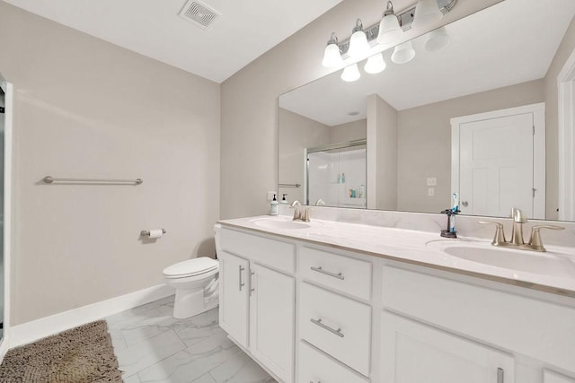 bathroom featuring marble finish floor, visible vents, a sink, and a shower stall