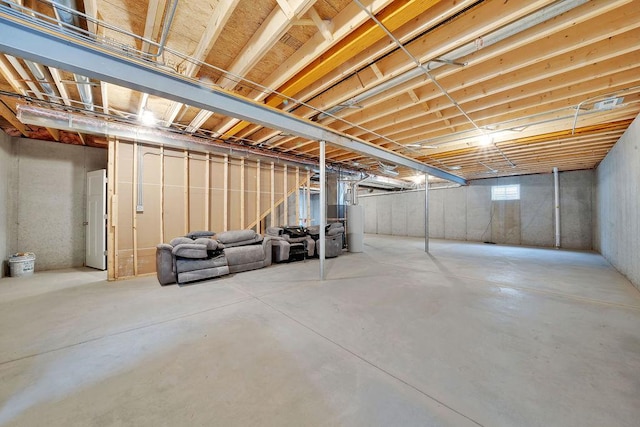 below grade area featuring water heater and stairs