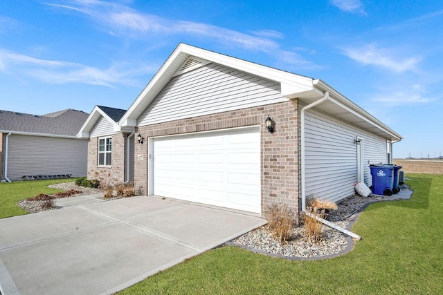 view of property exterior featuring a lawn, brick siding, a garage, and driveway