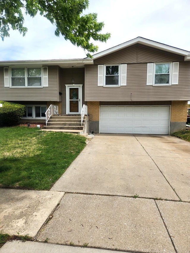 17109 Magnolia Dr, Hazel Crest, IL 60429 - bi-level home featuring an attached garage, driveway, a front lawn, and brick siding