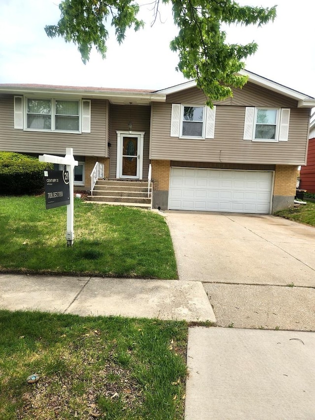 17109 Magnolia Dr, Hazel Crest, IL 60429 - raised ranch with an attached garage, driveway, and a front yard