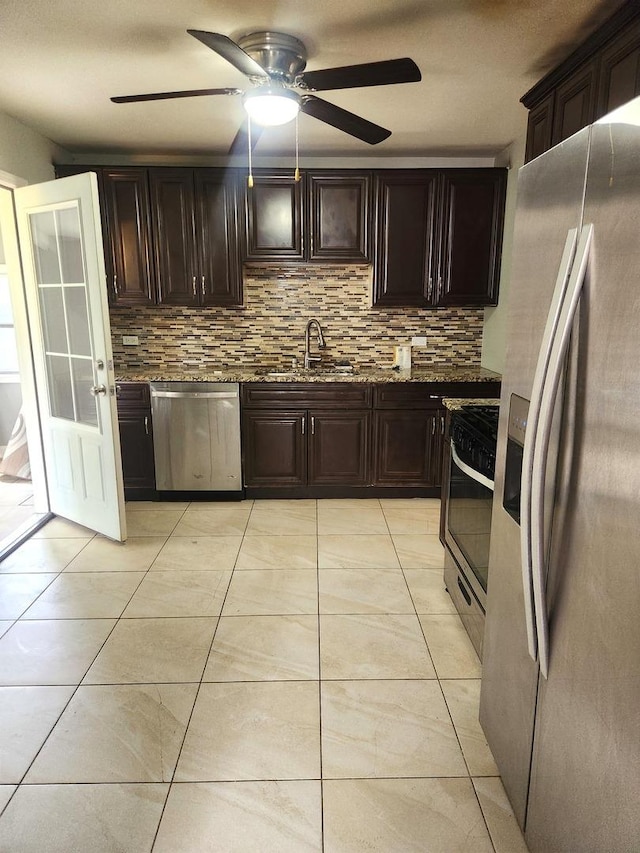 17109 Magnolia Dr, Hazel Crest, IL 60429 - kitchen with stainless steel appliances, a sink, tasteful backsplash, ceiling fan, and light stone countertops