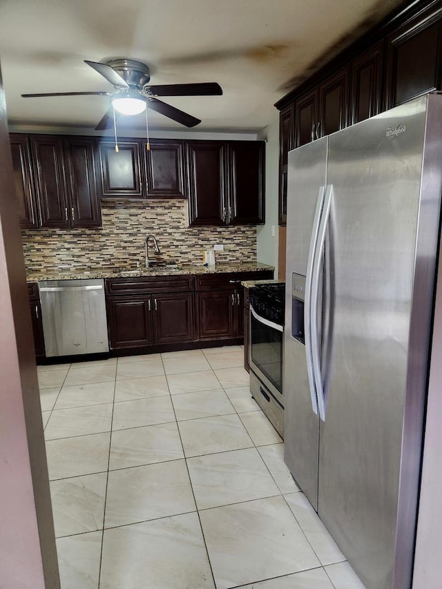 17109 Magnolia Dr, Hazel Crest, IL 60429 - kitchen featuring stainless steel appliances, a sink, tasteful backsplash, a ceiling fan, and light tile patterned flooring