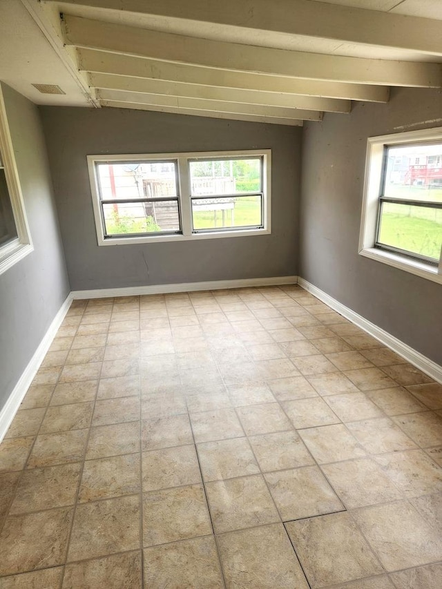17109 Magnolia Dr, Hazel Crest, IL 60429 - empty room featuring plenty of natural light, beamed ceiling, and baseboards