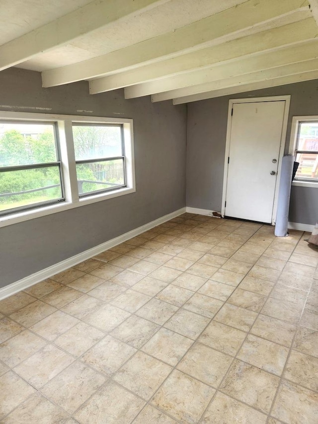 17109 Magnolia Dr, Hazel Crest, IL 60429 - spare room with baseboards and beam ceiling