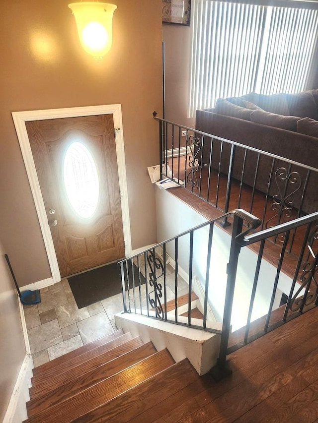 17109 Magnolia Dr, Hazel Crest, IL 60429 - foyer with baseboards, stairway, and stone finish floors