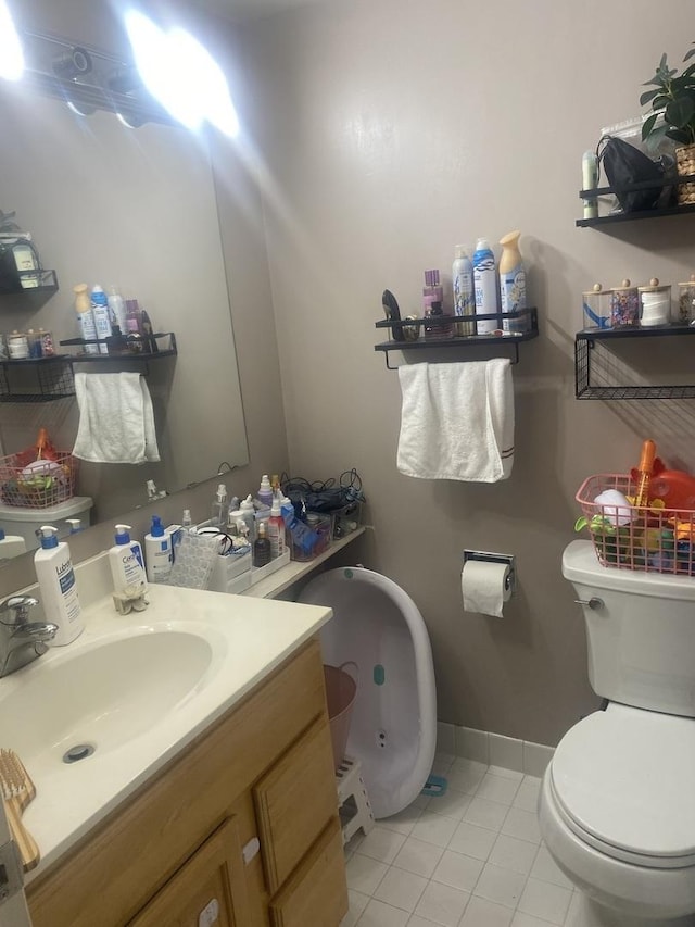 6340 Americana Dr Unit 1213, Willowbrook, IL 60527 - bathroom with toilet, tile patterned floors, baseboards, and vanity