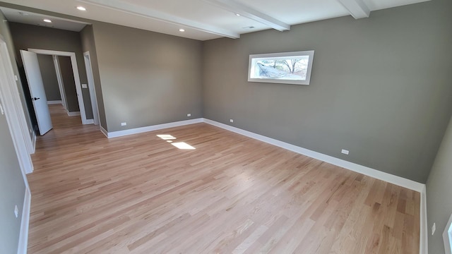 empty room with baseboards, light wood-style flooring, beam ceiling, and recessed lighting