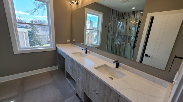 full bathroom featuring a sink, plenty of natural light, and a shower stall
