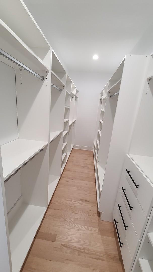 spacious closet with light wood-style floors