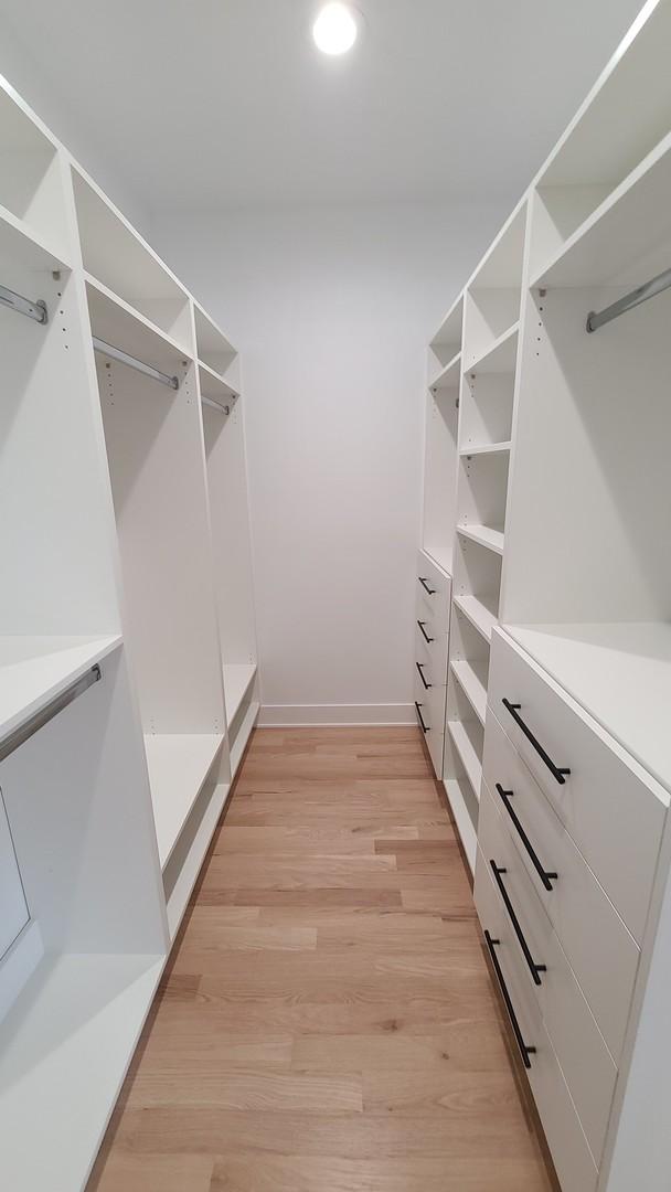 spacious closet featuring light wood-style flooring