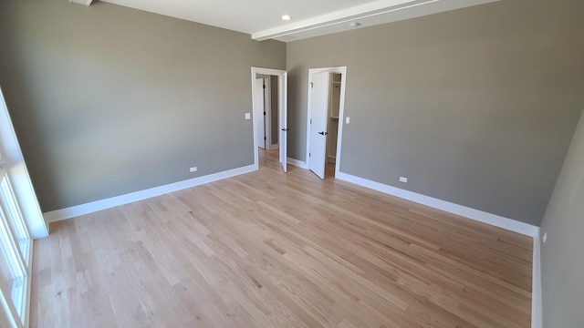 unfurnished room featuring light wood-style floors and baseboards