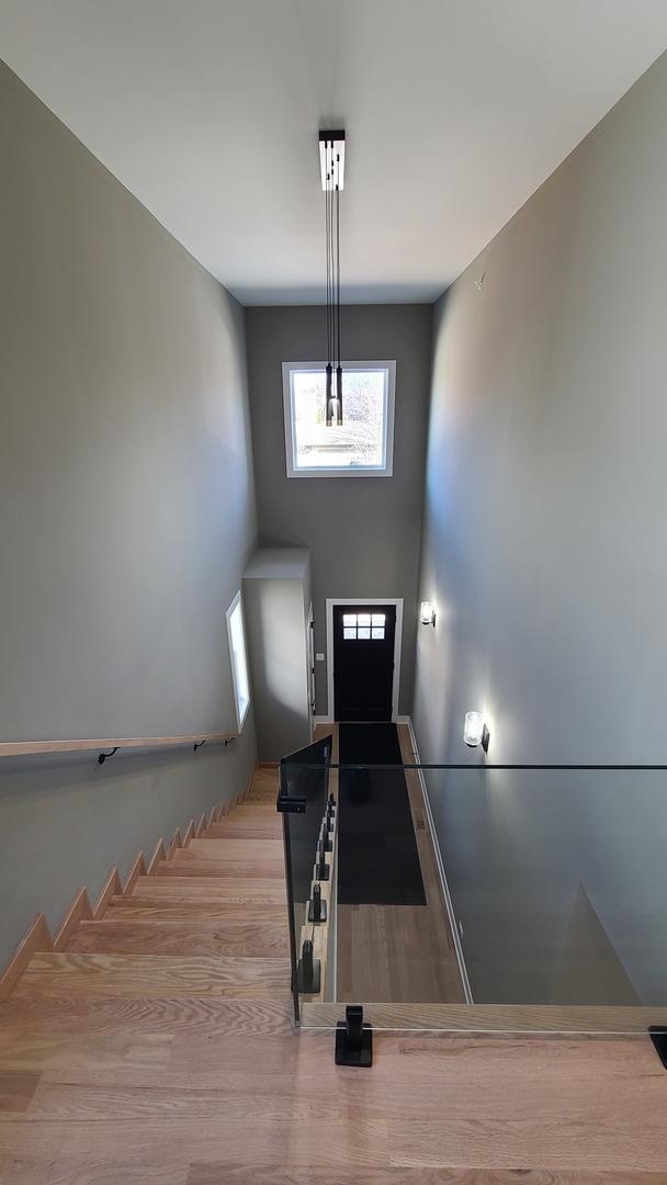staircase featuring wood finished floors
