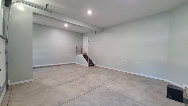 garage with baseboards and recessed lighting