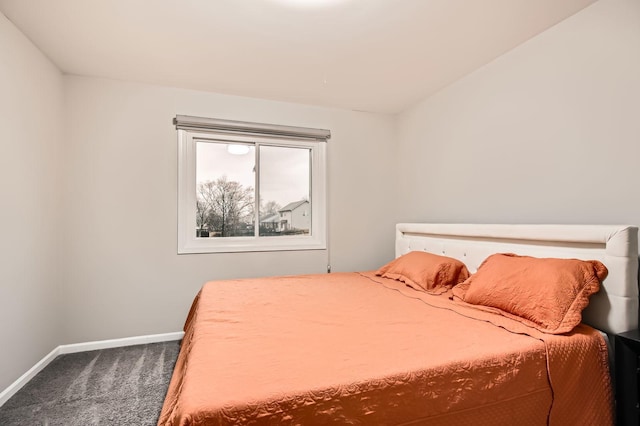 bedroom with baseboards and carpet floors