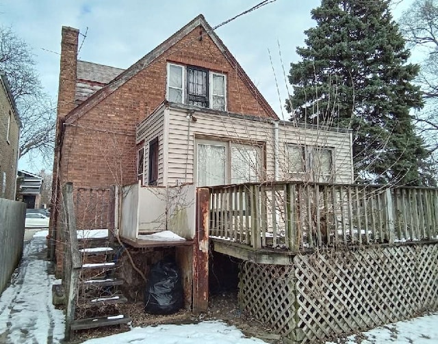 10238 S Rhodes Ave, Chicago, IL 60628 - rear view of property featuring a chimney, fence, a wooden deck, and roof with shingles