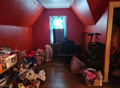 10238 S Rhodes Ave, Chicago, IL 60628 - interior space with wood finished floors and vaulted ceiling
