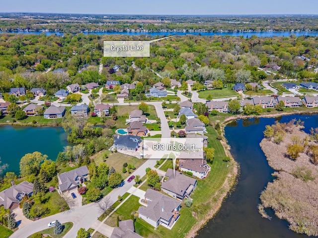 aerial perspective of suburban area featuring a large body of water