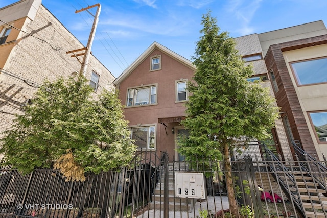 1943 N Whipple St, Chicago, IL 60647 - townhome / multi-family property with a fenced front yard and stairway