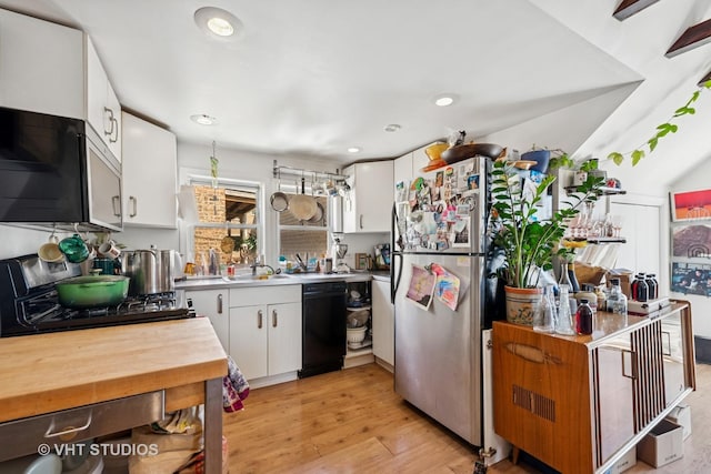 1943 N Whipple St, Chicago, IL 60647 - kitchen featuring freestanding refrigerator, white cabinetry, light wood-type flooring, recessed lighting, and black dishwasher