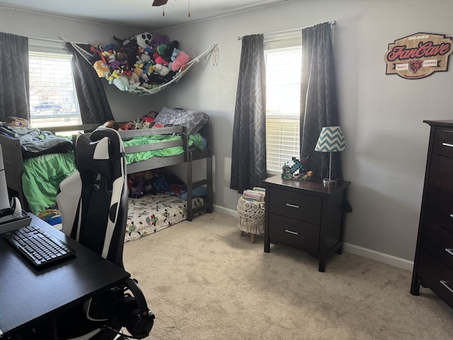 bedroom with carpet, baseboards, and ceiling fan