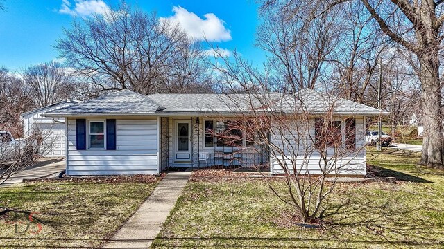161 S Cash St, Seneca, IL 61360 - ranch-style home featuring roof with shingles, a porch, and a front yard