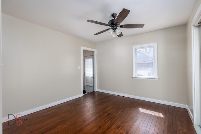 161 S Cash St, Seneca, IL 61360 - spare room with baseboards, ceiling fan, and dark wood finished floors