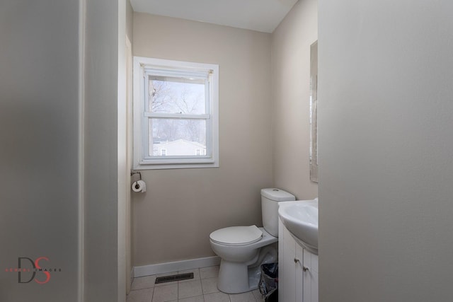 161 S Cash St, Seneca, IL 61360 - half bathroom featuring visible vents, baseboards, toilet, tile patterned floors, and vanity