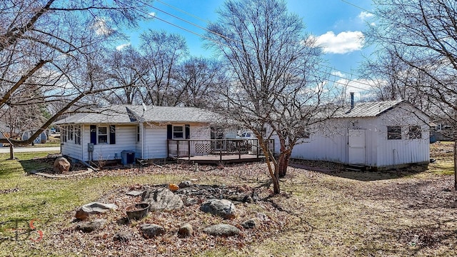 161 S Cash St, Seneca, IL 61360 - rear view of property featuring a lawn and a wooden deck