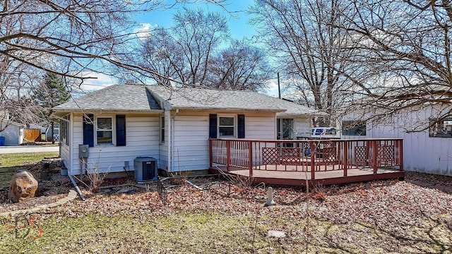 161 S Cash St, Seneca, IL 61360 - back of property with central air condition unit, roof with shingles, and a wooden deck