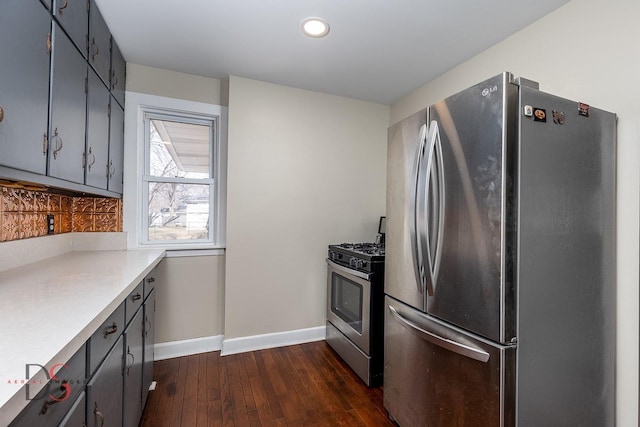 161 S Cash St, Seneca, IL 61360 - kitchen with dark wood-style flooring, light countertops, baseboards, stainless steel appliances, and gray cabinets