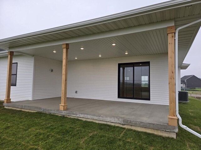 2477 Stanfield Ln, Normal, IL 61761 - rear view of property with a patio area, central AC unit, and a lawn