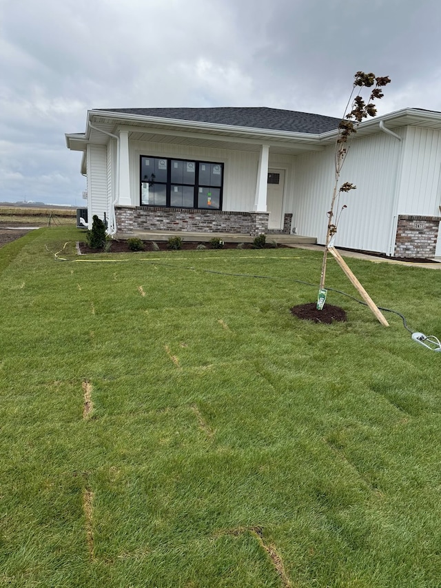 2477 Stanfield Ln, Normal, IL 61761 - view of front facade featuring brick siding and a front yard