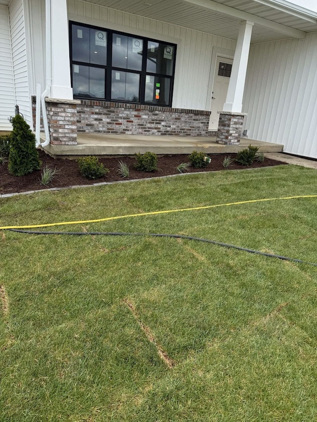 2477 Stanfield Ln, Normal, IL 61761 - exterior space with a yard, brick siding, and covered porch