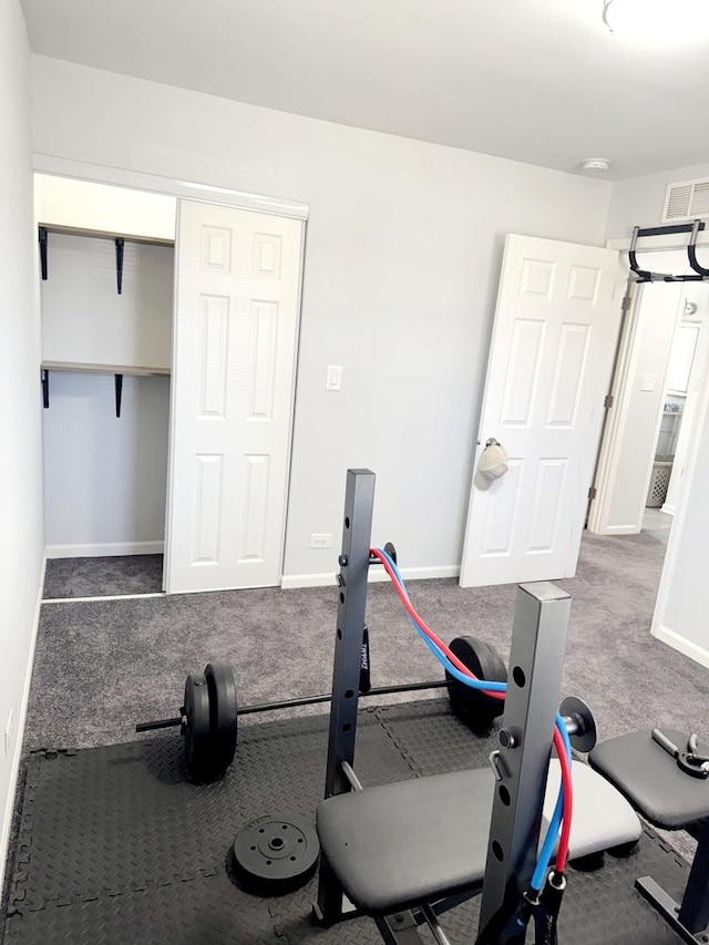 exercise area with baseboards and visible vents