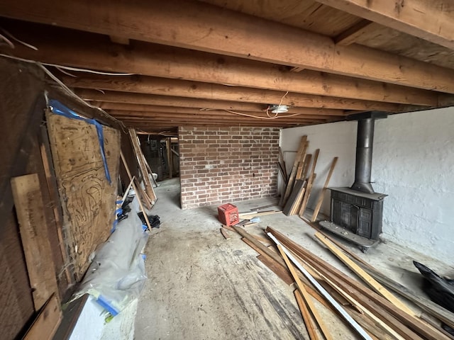 unfinished basement with a wood stove