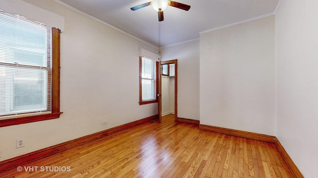 3028 N Kostner Ave, Chicago, IL 60641 - spare room with baseboards, ornamental molding, light wood-style flooring, and a ceiling fan