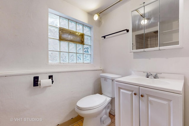 3028 N Kostner Ave, Chicago, IL 60641 - bathroom with toilet, tile patterned flooring, and vanity