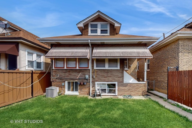 3028 N Kostner Ave, Chicago, IL 60641 - back of house with cooling unit, brick siding, fence, and a lawn