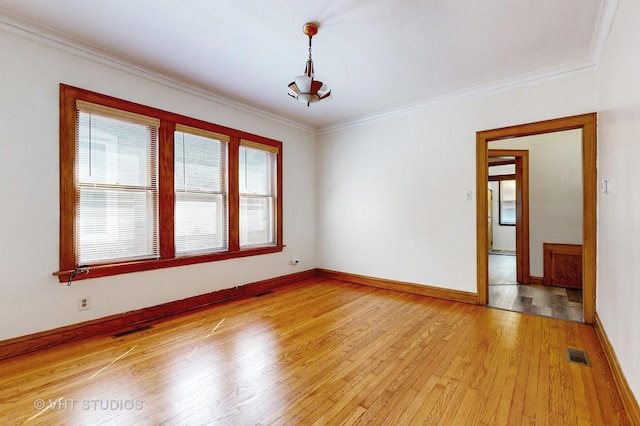 3028 N Kostner Ave, Chicago, IL 60641 - unfurnished room featuring light wood-type flooring, crown molding, and visible vents