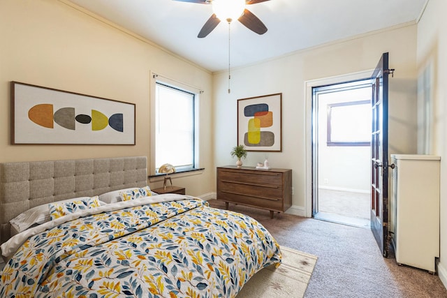 bedroom featuring baseboards, carpet floors, ornamental molding, and ceiling fan