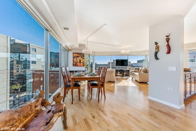 1720 Maple Ave Unit 610, Evanston, IL 60201 - dining area with light wood finished floors